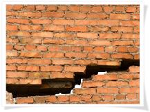 Cracked brick wall.